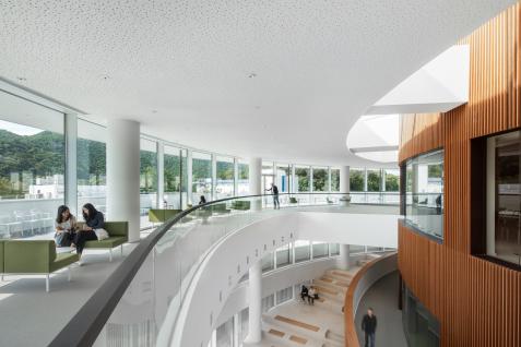 The Foyer area outside the main hall offers cozy space for mingling. (Photo credit: Henning Larsen Architects)