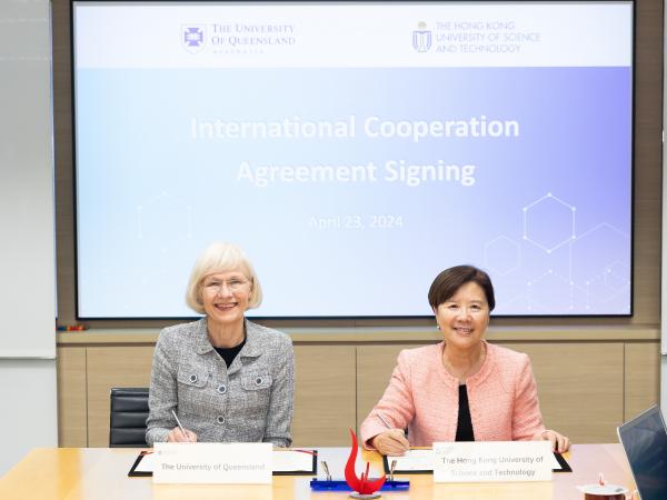 HKUST President Prof. Nancy IP (right) signs the cooperation agreement with the University of Queensland Vice-Chancellor and President Prof. Deborah TERRY AC (left). 