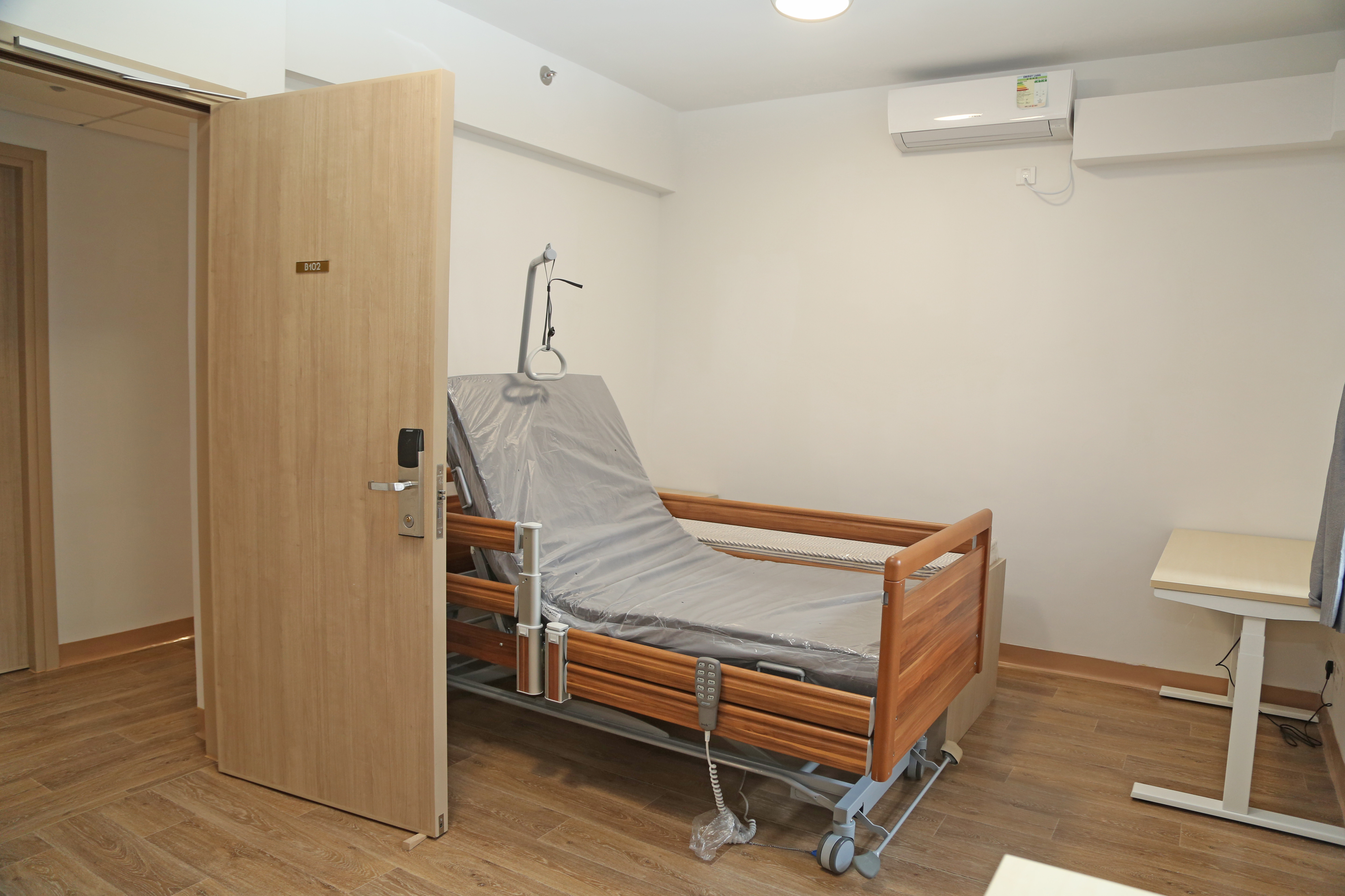 Assistive furniture such as adjustable bed is available in the purpose-designed bedroom to help the daily living of physically-challenged students.
