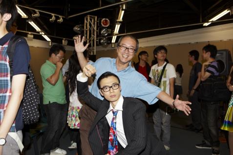 President Chan and actor Yu Yu in a dramatic pose	